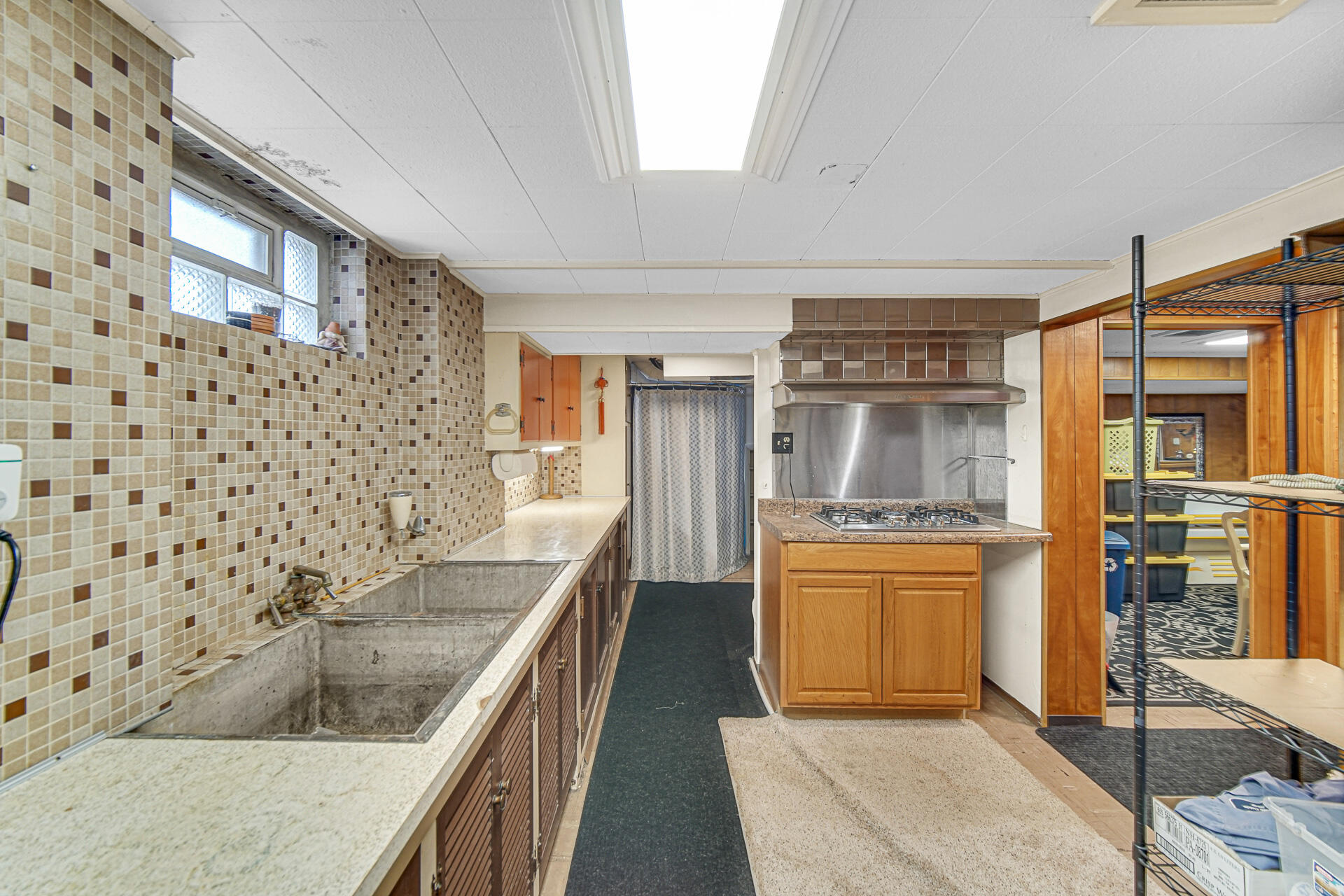 928 176th Street Hammond, IN 46324 - Photo 15 of 25 a kitchen with stainless steel appliances granite countertop a sink stove and refrigerator