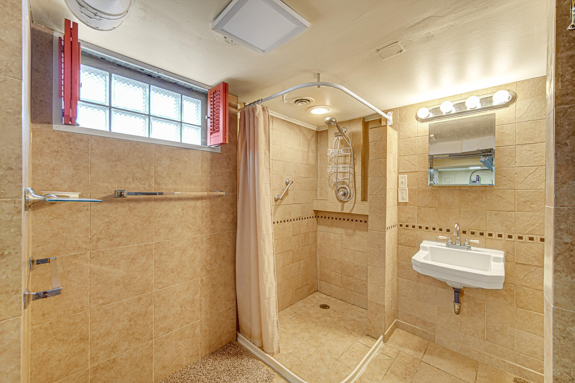 928 176th Street Hammond, IN 46324 - Photo 17 of 25 a bathroom with a shower and a sink