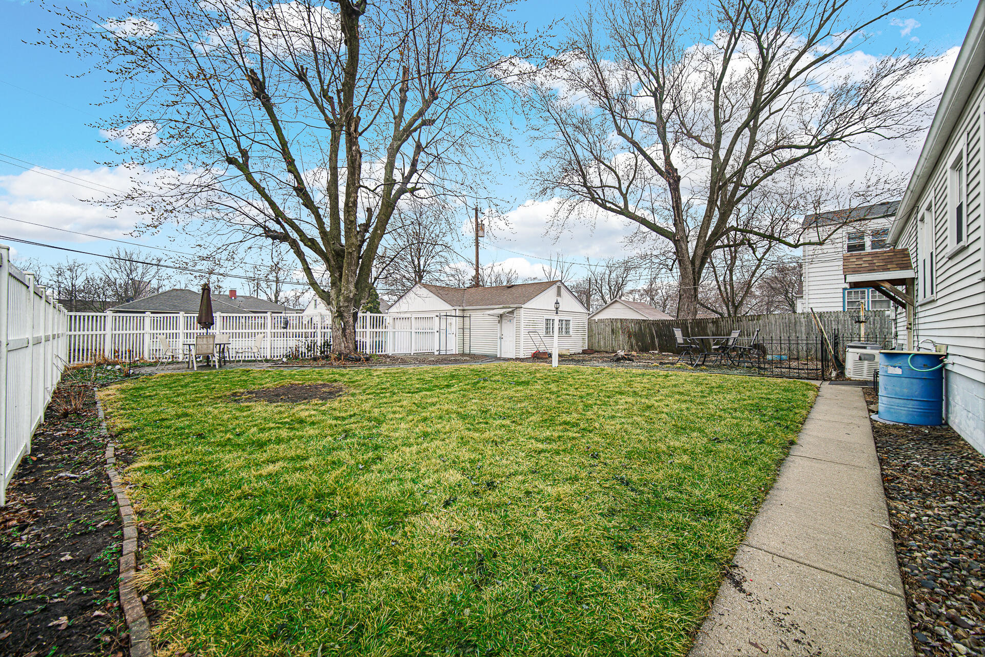 928 176th Street Hammond, IN 46324 - Photo 20 of 25 a view of a backyard with a white house