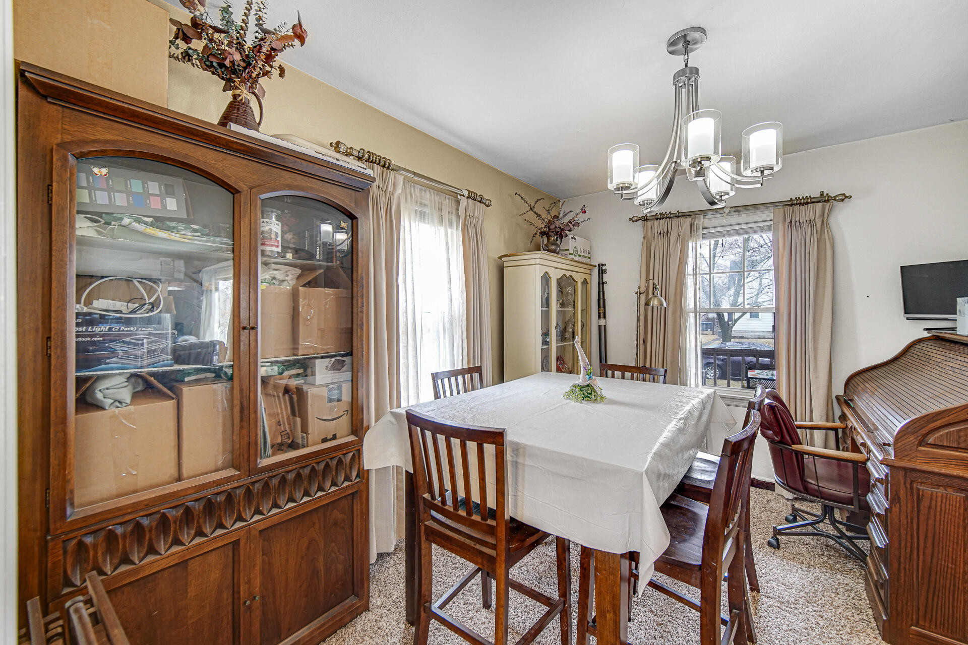 928 176th Street Hammond, IN 46324 - Photo 4 of 25 a view of a dining room with furniture and a chandelier