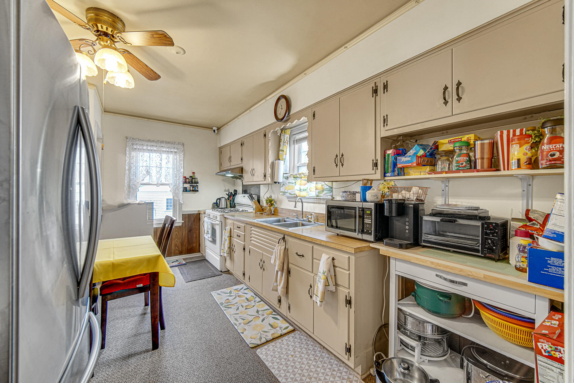 928 176th Street Hammond, IN 46324 - Photo 5 of 25 a kitchen with stainless steel appliances granite countertop a stove a sink dishwasher and cabinets with wooden floor