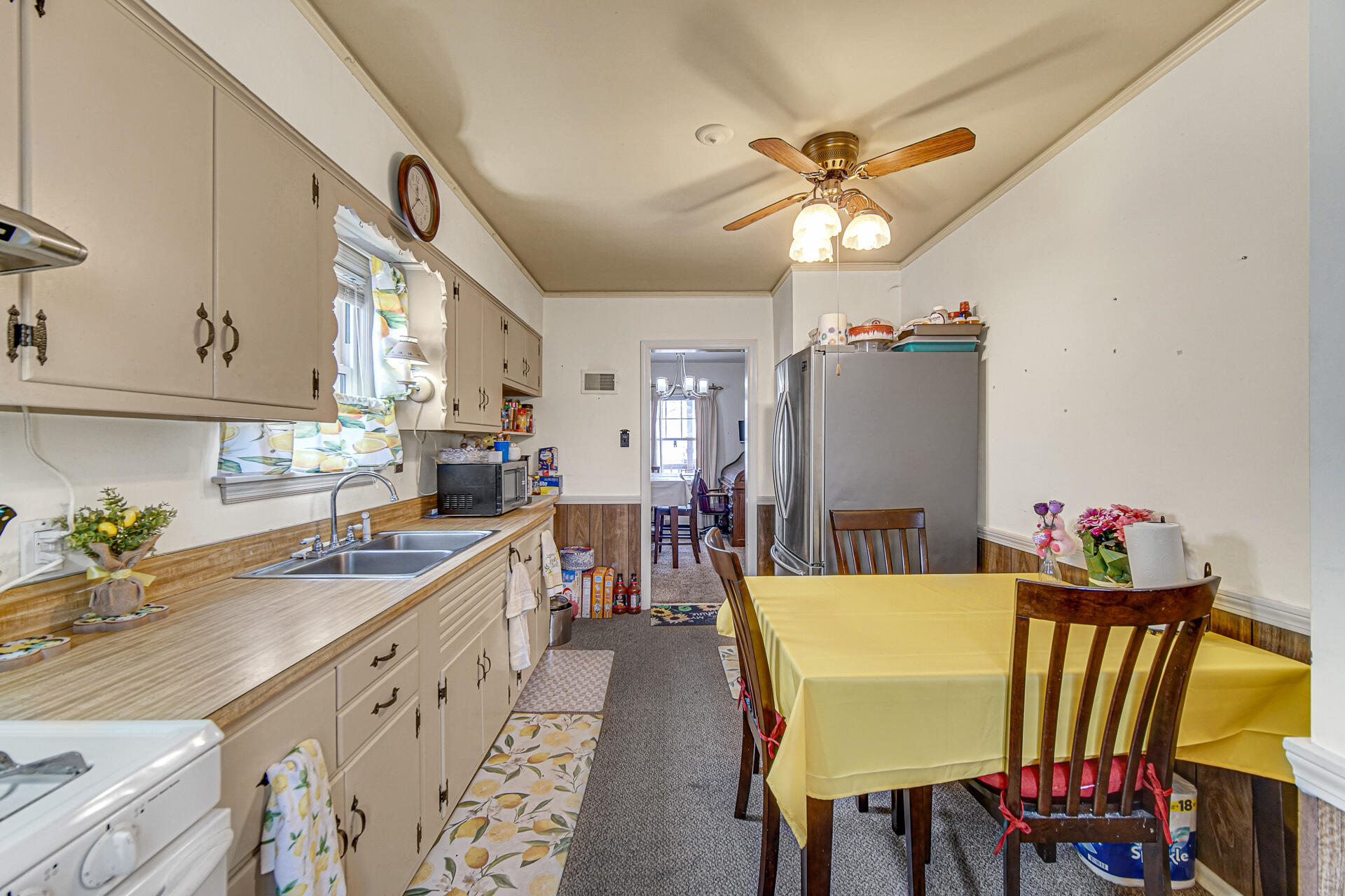 928 176th Street Hammond, IN 46324 - Photo 7 of 25 a view of a dining room with furniture and a kitchen