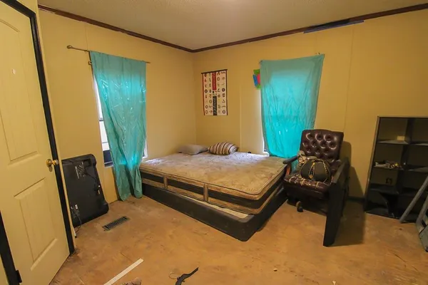 a bedroom with a bed and furniture