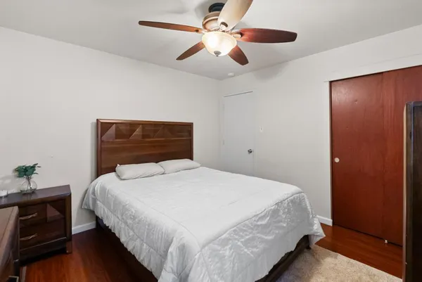 a kitchen with stainless steel appliances granite countertop a sink a stove a refrigerator with a dining table and chairs