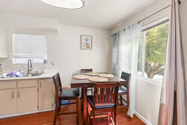a kitchen with stainless steel appliances granite countertop a stove and a white cabinets