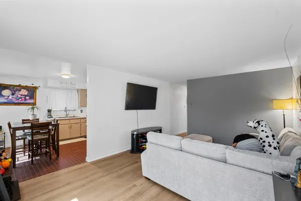 a kitchen with cabinets stainless steel appliances and a counter space
