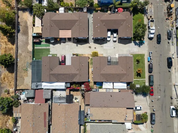 an aerial view of a houses with outdoor space