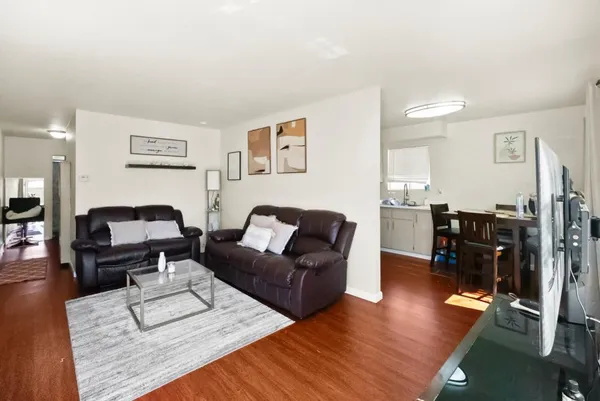 a bedroom with a bed and a tv