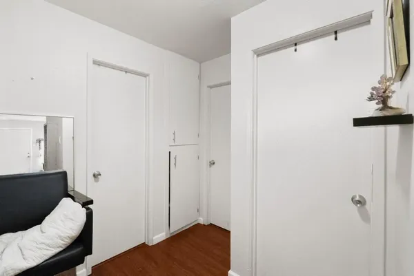 a bedroom with a bed and a ceiling fan