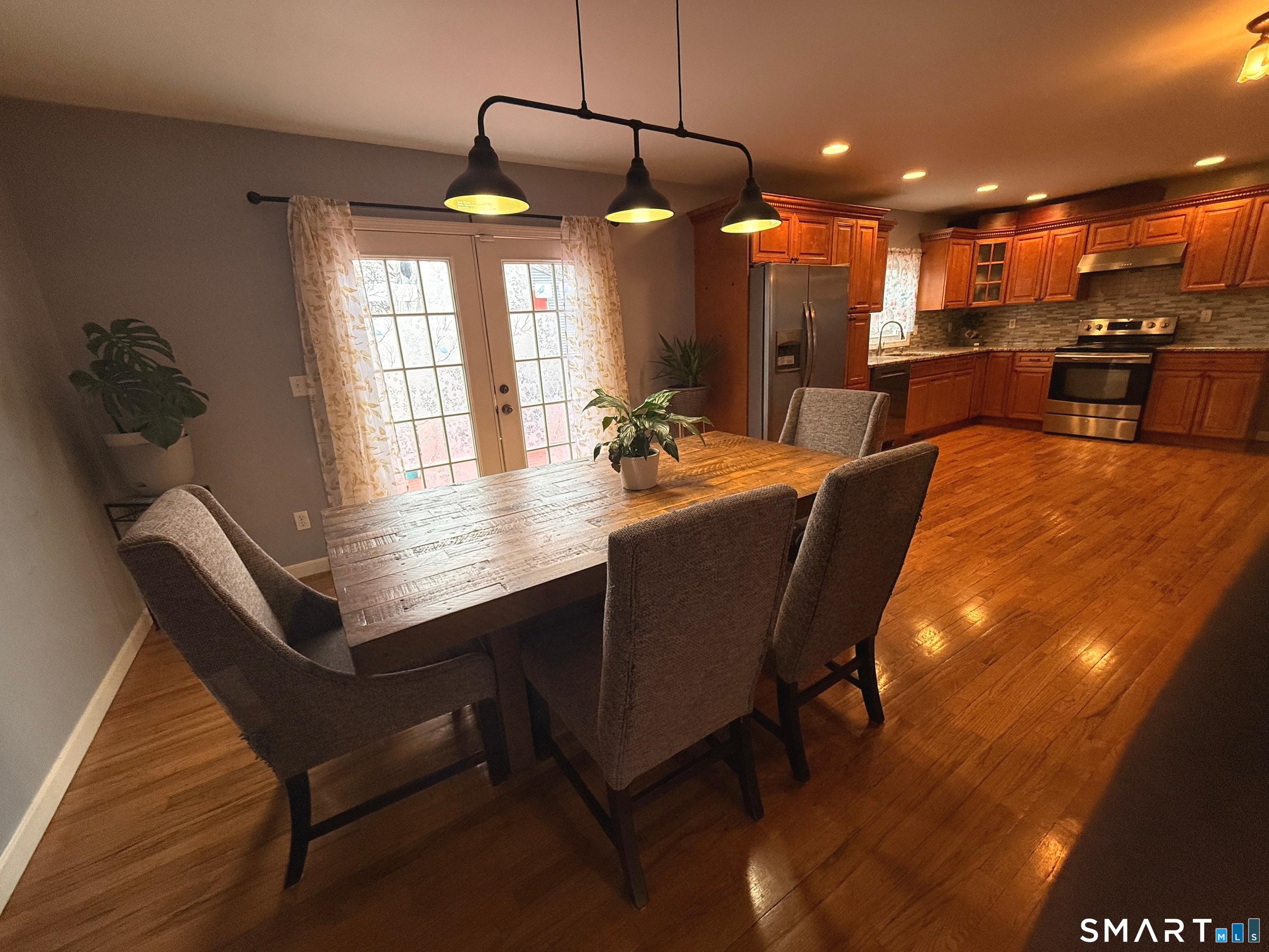 47 Oronoque Trail Shelton, CT 06484 - Photo 14 of 44 a dining room with a table and chairs