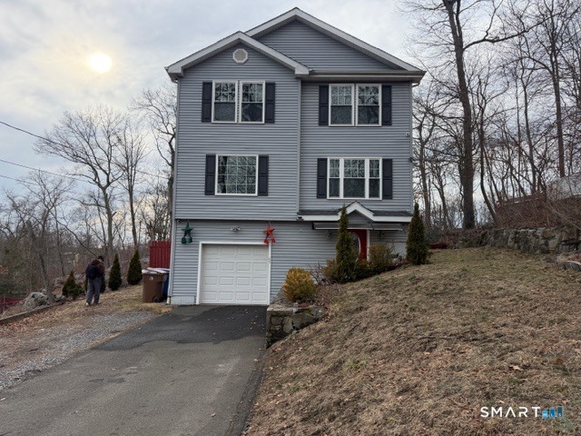 47 Oronoque Trail Shelton, CT 06484 - Photo 2 of 44 a view of a house with a yard and large tree