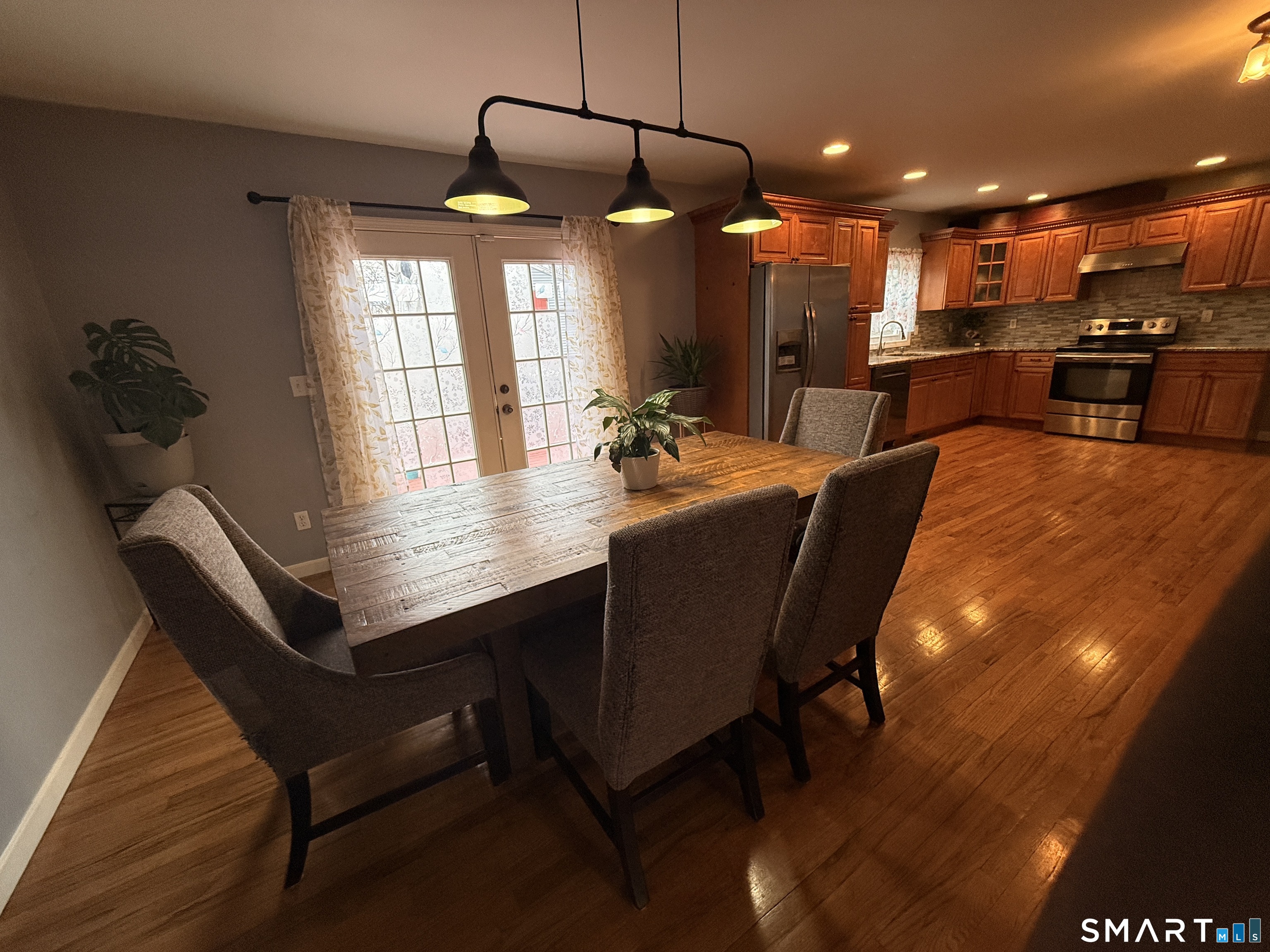 47 Oronoque Trail Shelton, CT 06484 - Photo 23 of 44 a dining room with a table and chairs
