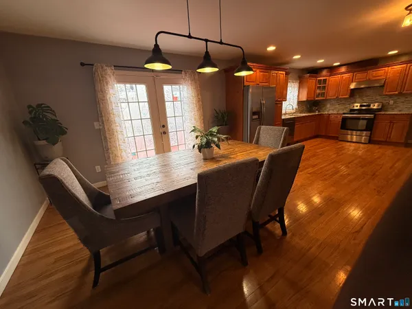 a dining room with a table and chairs