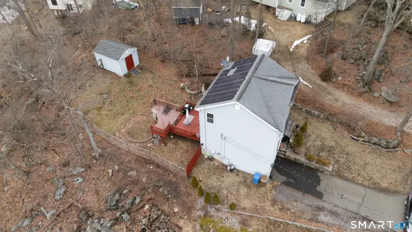 a aerial view of a house with a yard