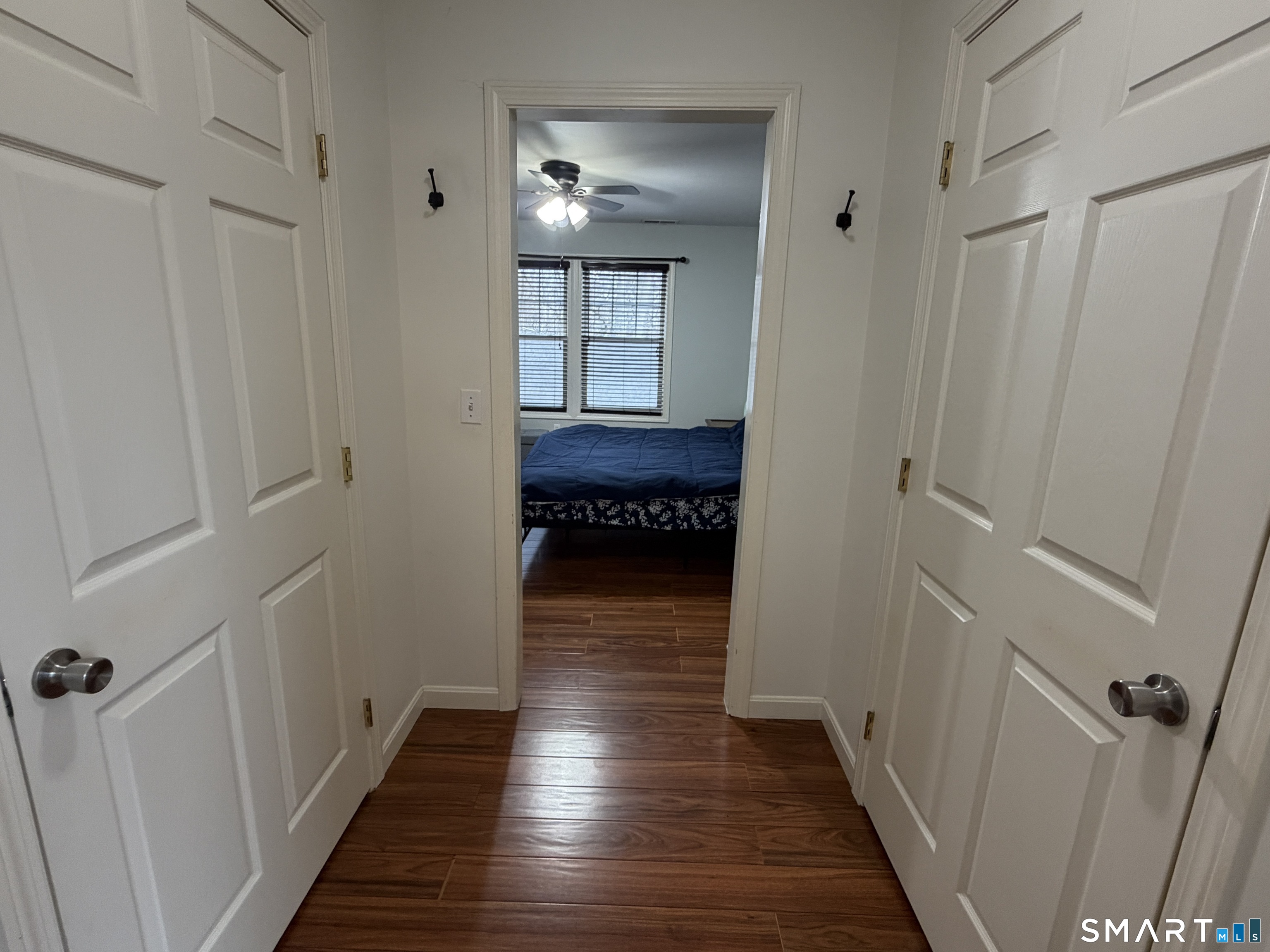 47 Oronoque Trail Shelton, CT 06484 - Photo 38 of 44 a view of a hallway with wooden floor and staircase