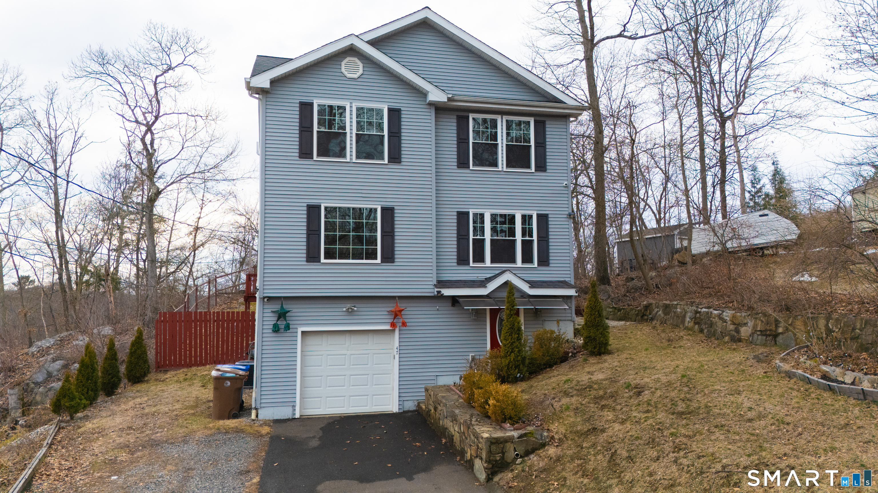 47 Oronoque Trail Shelton, CT 06484 - Photo 4 of 44 a front view of a house with a yard