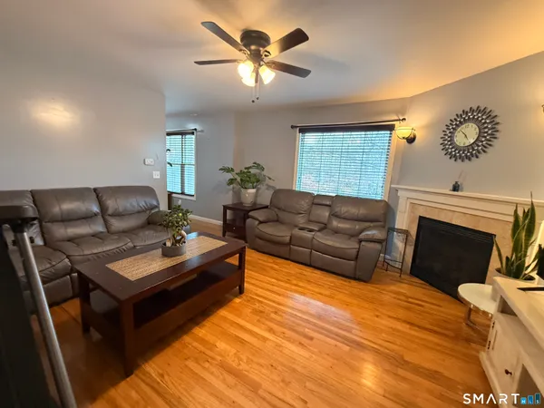 a living room with furniture and a fireplace