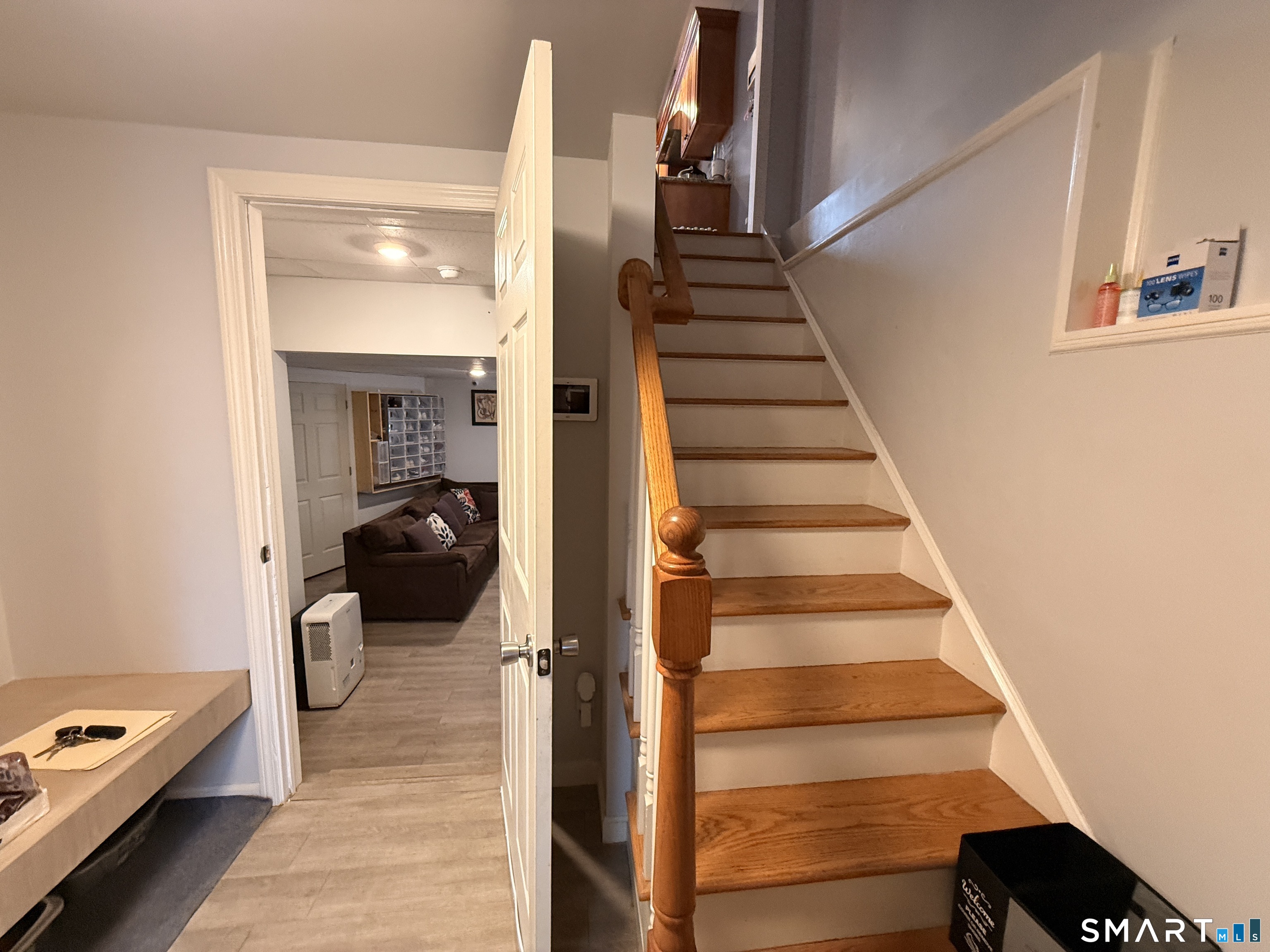 47 Oronoque Trail Shelton, CT 06484 - Photo 41 of 44 a view of entryway and hall with wooden floor