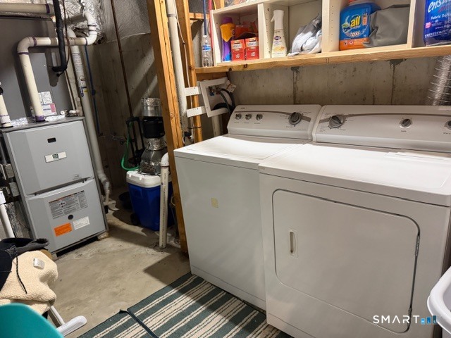 47 Oronoque Trail Shelton, CT 06484 - Photo 43 of 44 a utility room with dryer and washer