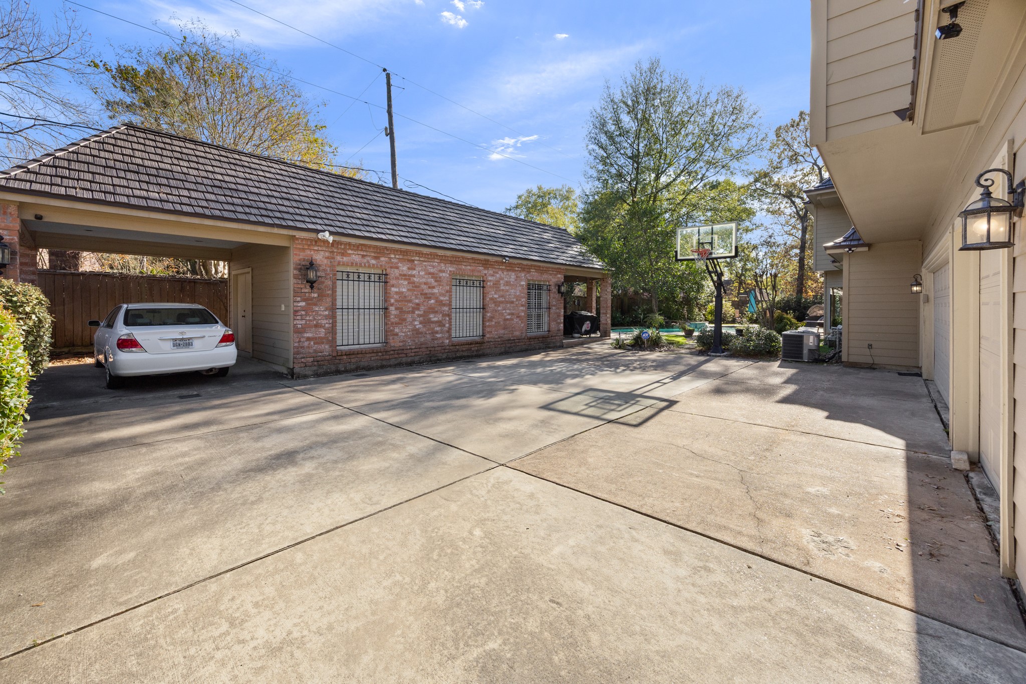 8807 Chelmsford Lane Spring, TX 77379 - Photo 48 of 50 Behind the driveway gate is the private motor court that offers ample guest parking options and room to play basketball.