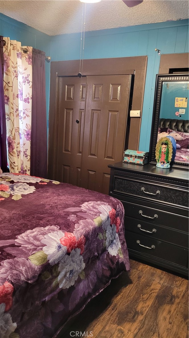 8600 South Gate South Gate, CA 90280 - Photo 14 of 20 a bedroom with a bed and a mirror on dresser