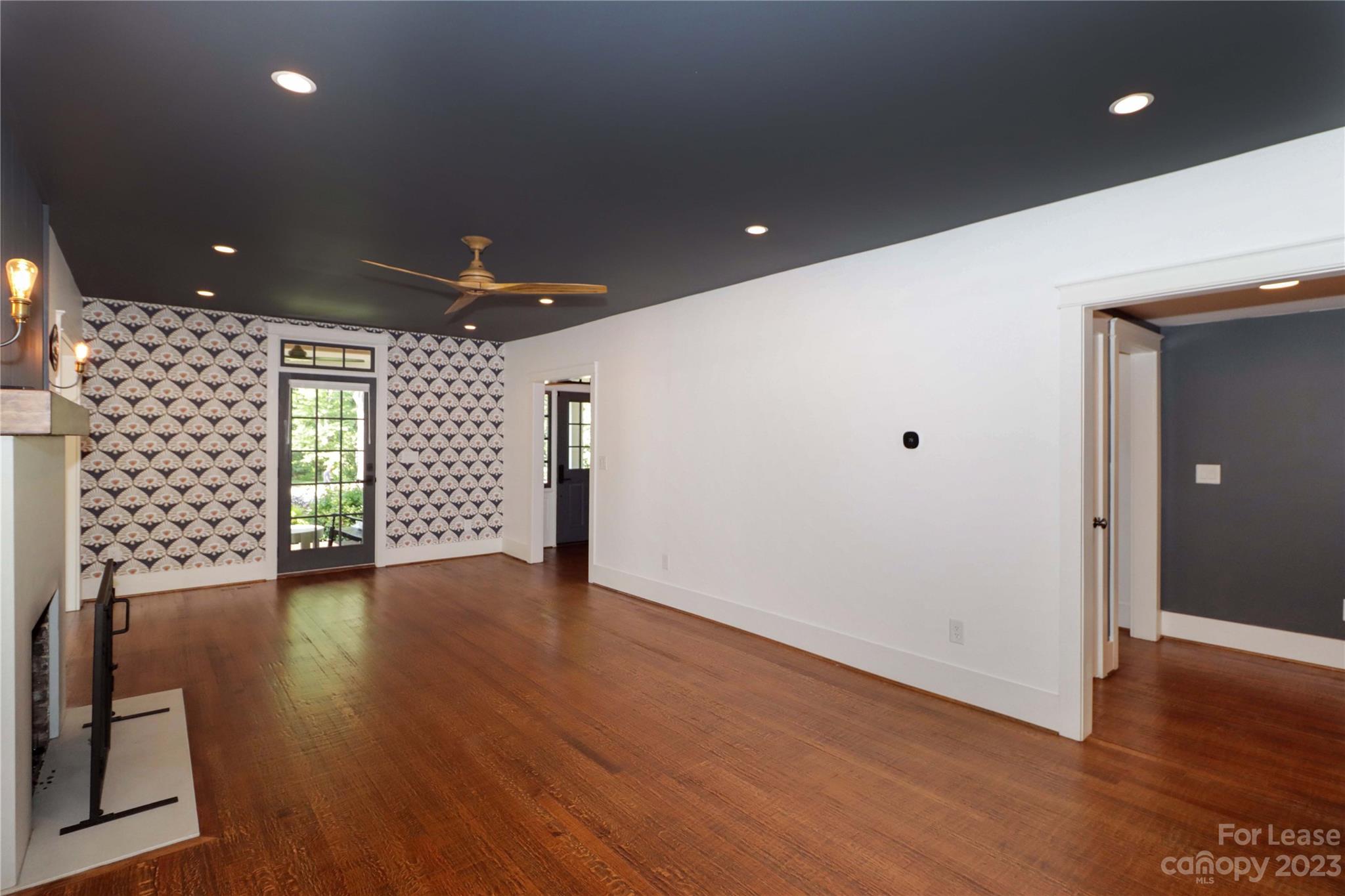 517 Lorimer Road Davidson, NC 28036 - Photo 13 of 48 an empty room with wooden floor and windows
