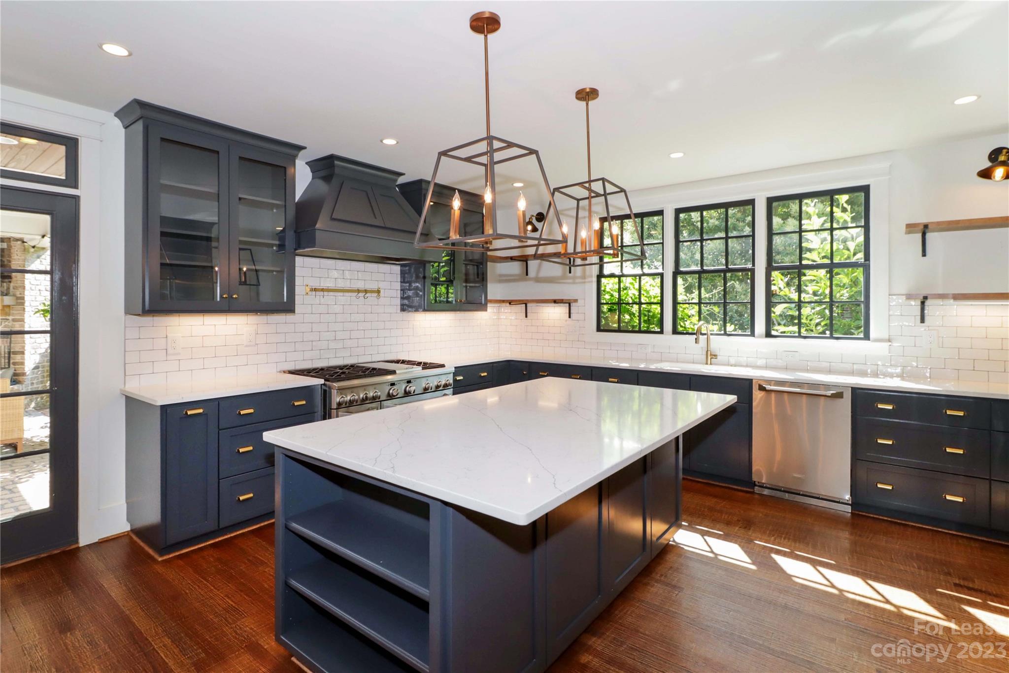 517 Lorimer Road Davidson, NC 28036 - Photo 16 of 48 a kitchen with a stove a sink and a window