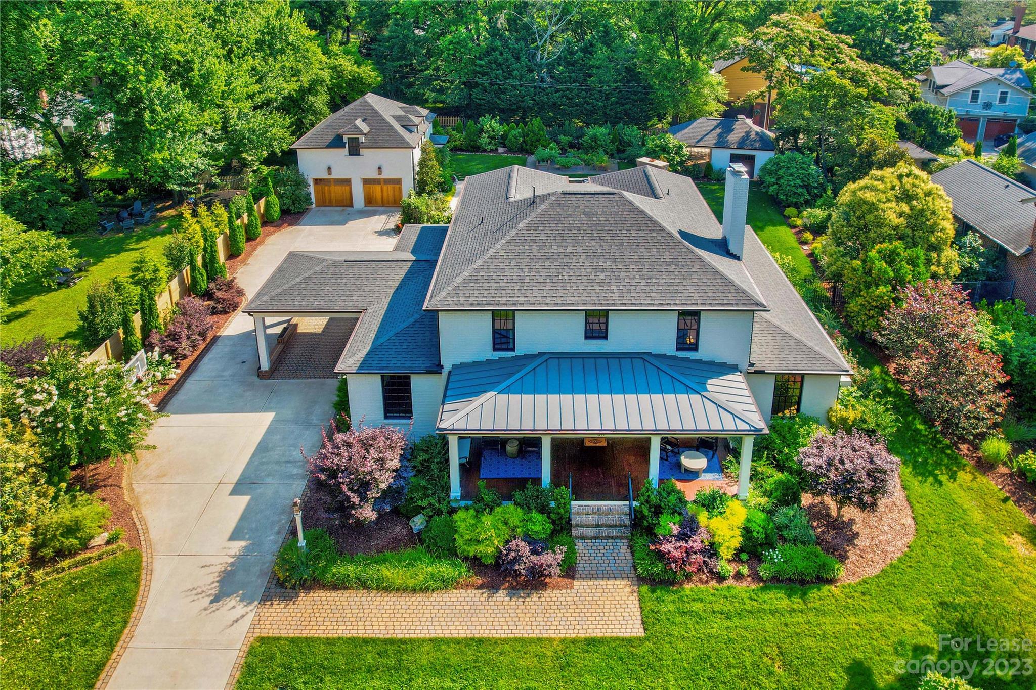 517 Lorimer Road Davidson, NC 28036 - Photo 2 of 48 a front view of a house with garden