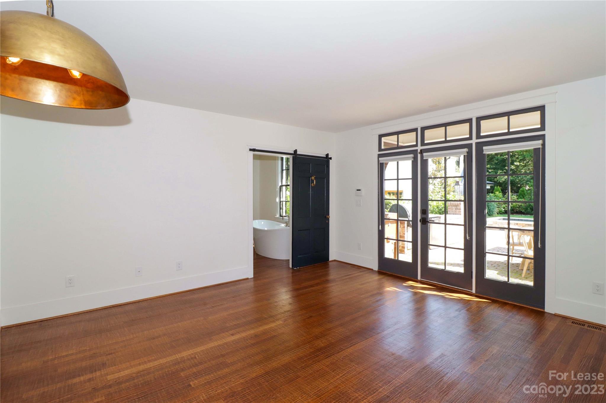 517 Lorimer Road Davidson, NC 28036 - Photo 21 of 48 wooden floor in an empty room with a window