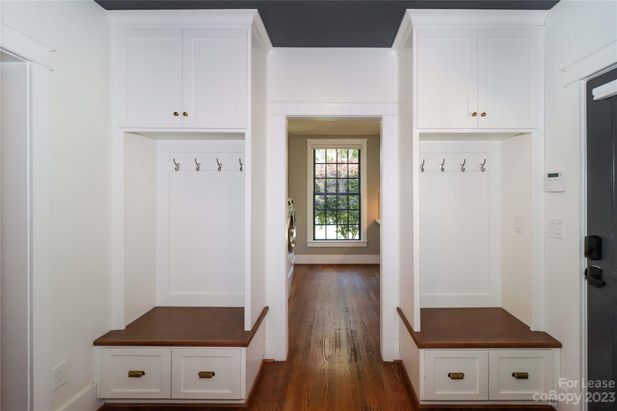 517 Lorimer Road Davidson, NC 28036 - Photo 24 of 48 a view of walk in closet with wooden floor