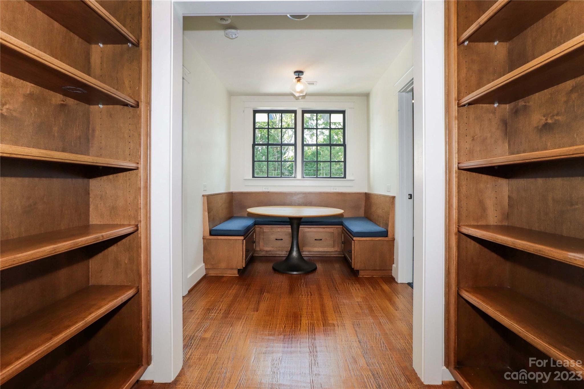 517 Lorimer Road Davidson, NC 28036 - Photo 27 of 48 a room that has a bed and a table in it