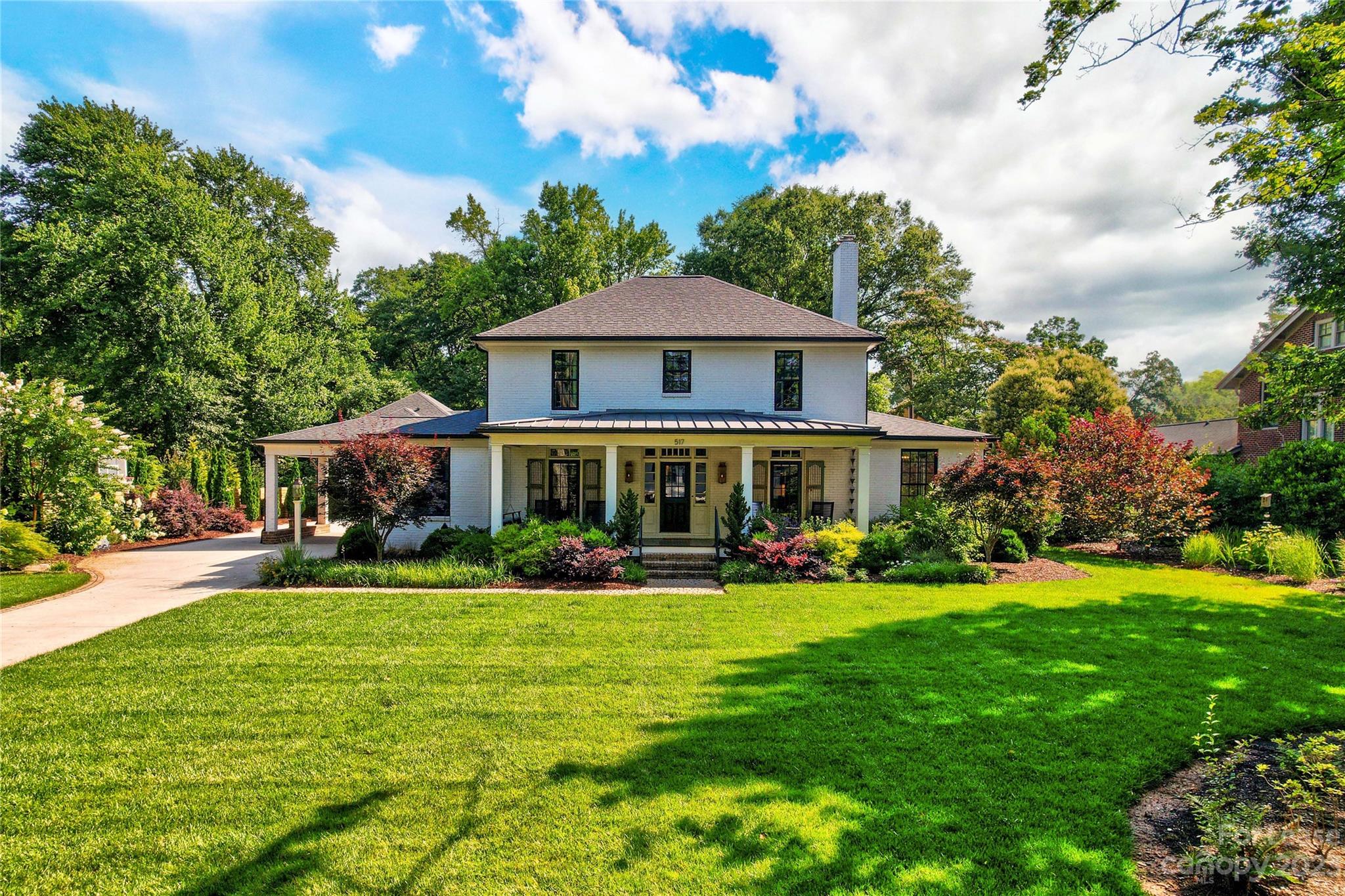 517 Lorimer Road Davidson, NC 28036 - Photo 3 of 48 a view of a house with a yard and sitting area