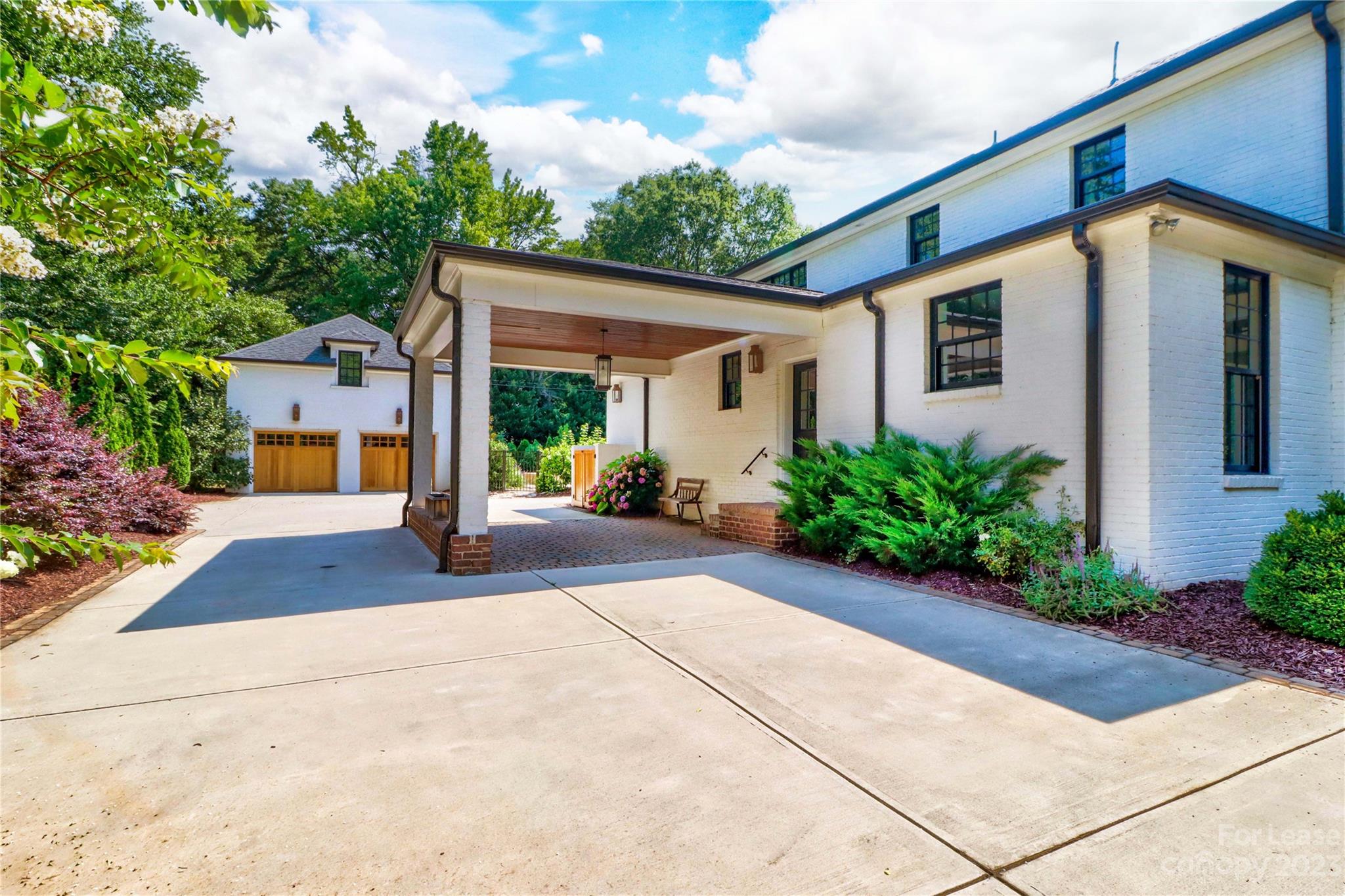 517 Lorimer Road Davidson, NC 28036 - Photo 33 of 48 a front view of a house with garden