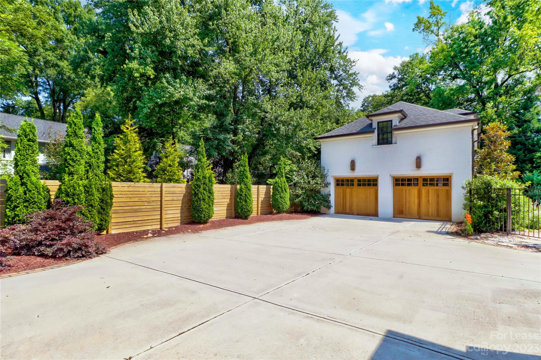 517 Lorimer Road Davidson, NC 28036 - Photo 34 of 48 a front view of a house with a yard and garage