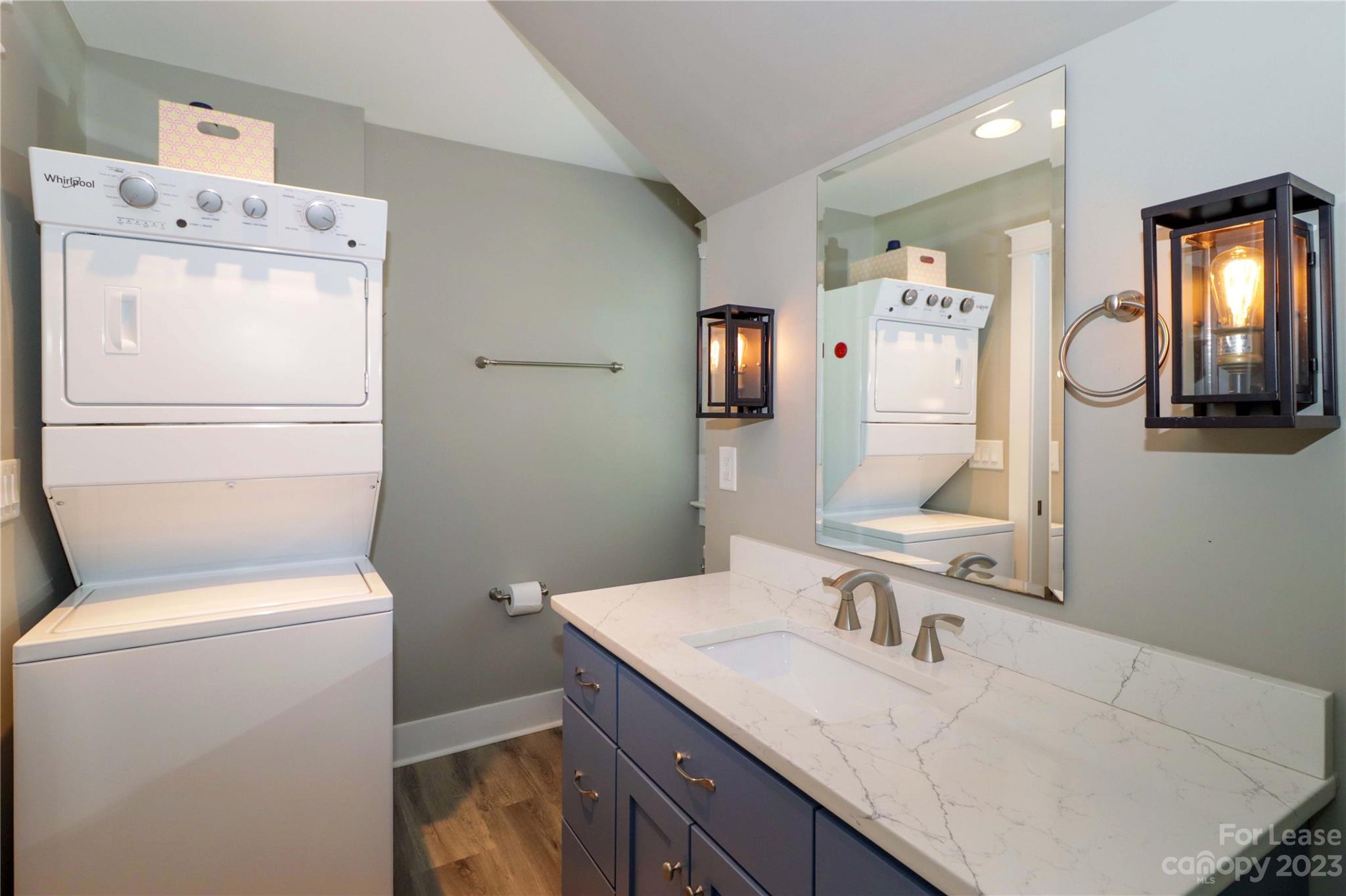 517 Lorimer Road Davidson, NC 28036 - Photo 39 of 48 a bathroom with a granite countertop toilet sink and mirror