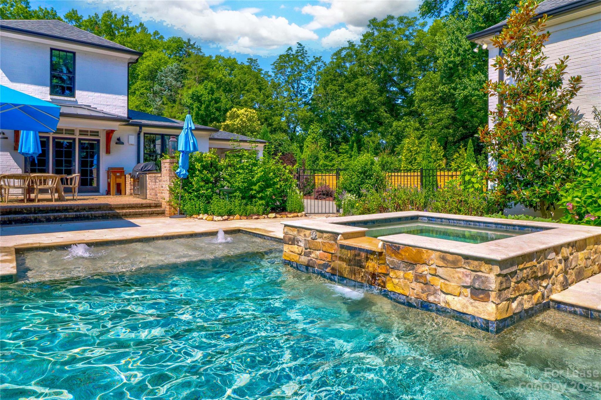 517 Lorimer Road Davidson, NC 28036 - Photo 41 of 48 front view of a house with a yard table and chairs
