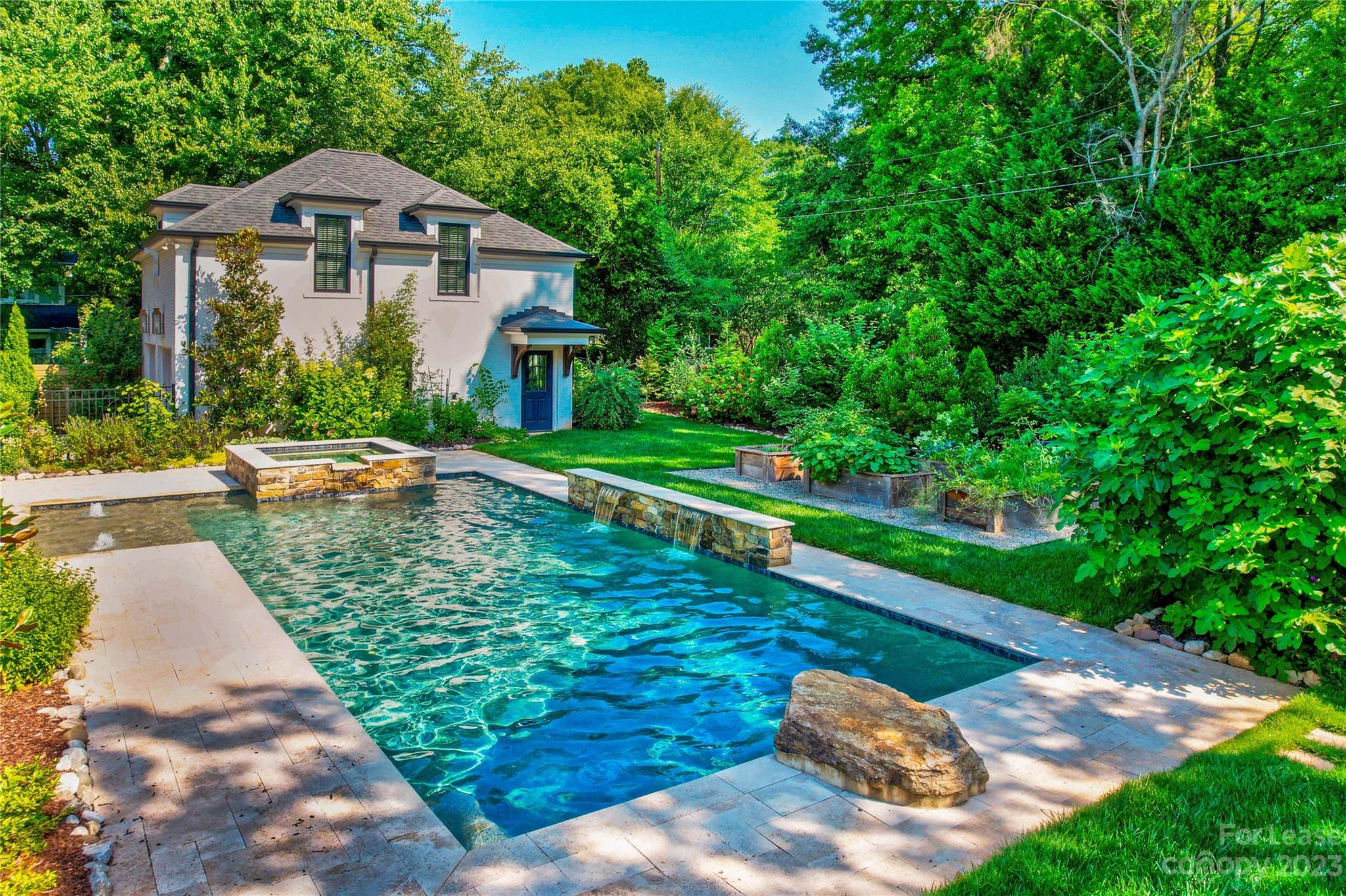 517 Lorimer Road Davidson, NC 28036 - Photo 42 of 48 a view of a small house with a yard