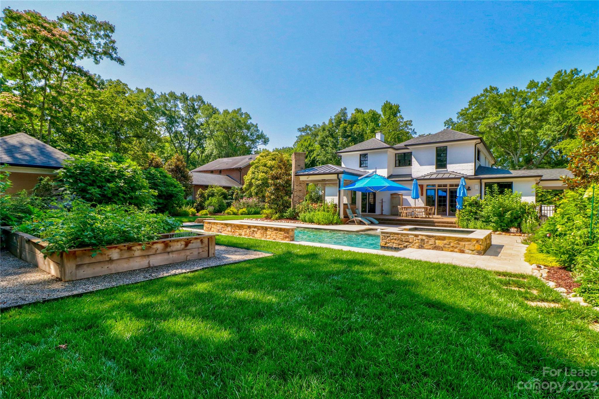 517 Lorimer Road Davidson, NC 28036 - Photo 43 of 48 a house view with a sitting space and garden
