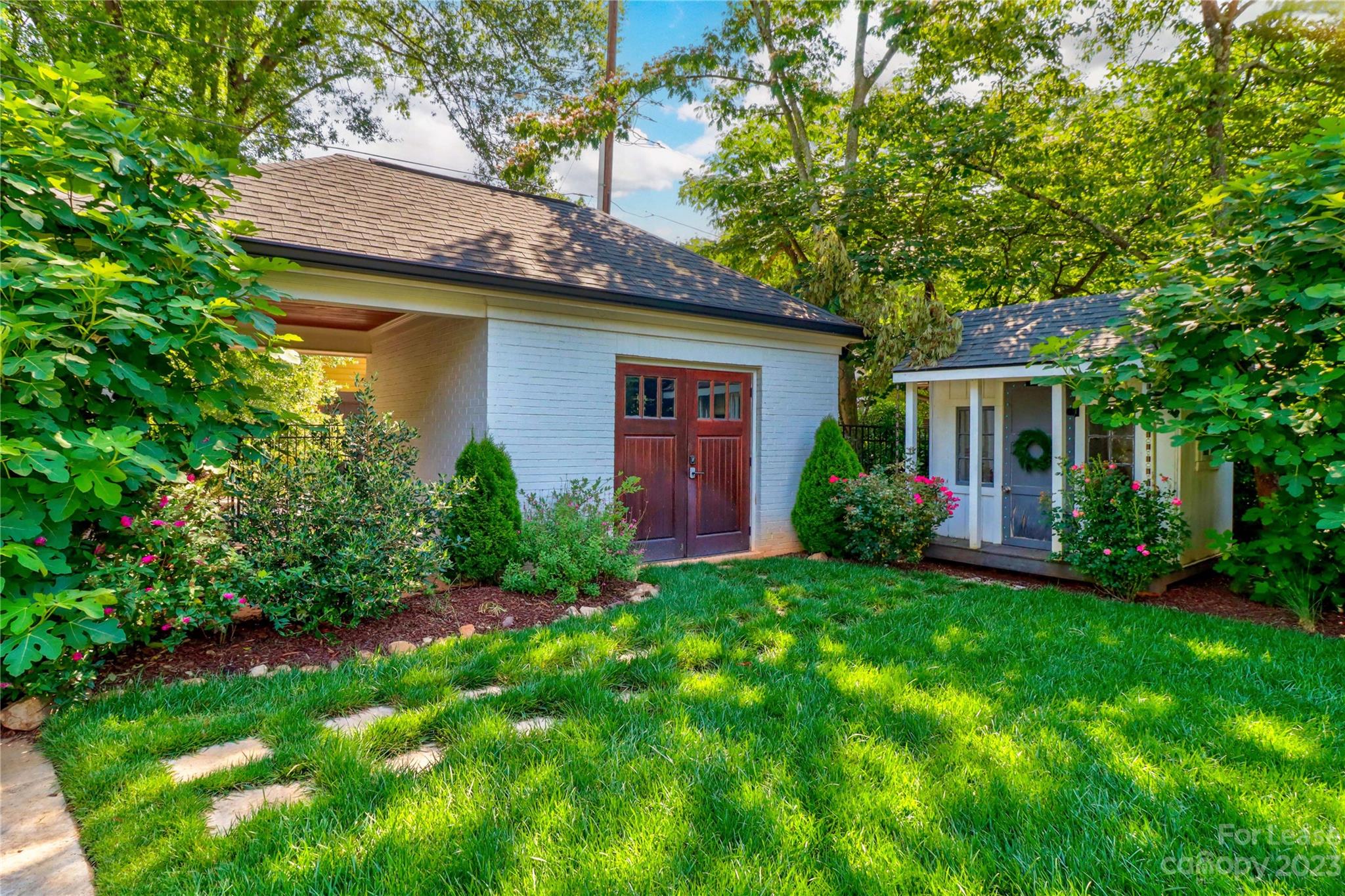 517 Lorimer Road Davidson, NC 28036 - Photo 44 of 48 a view of a house with a yard plants and large tree