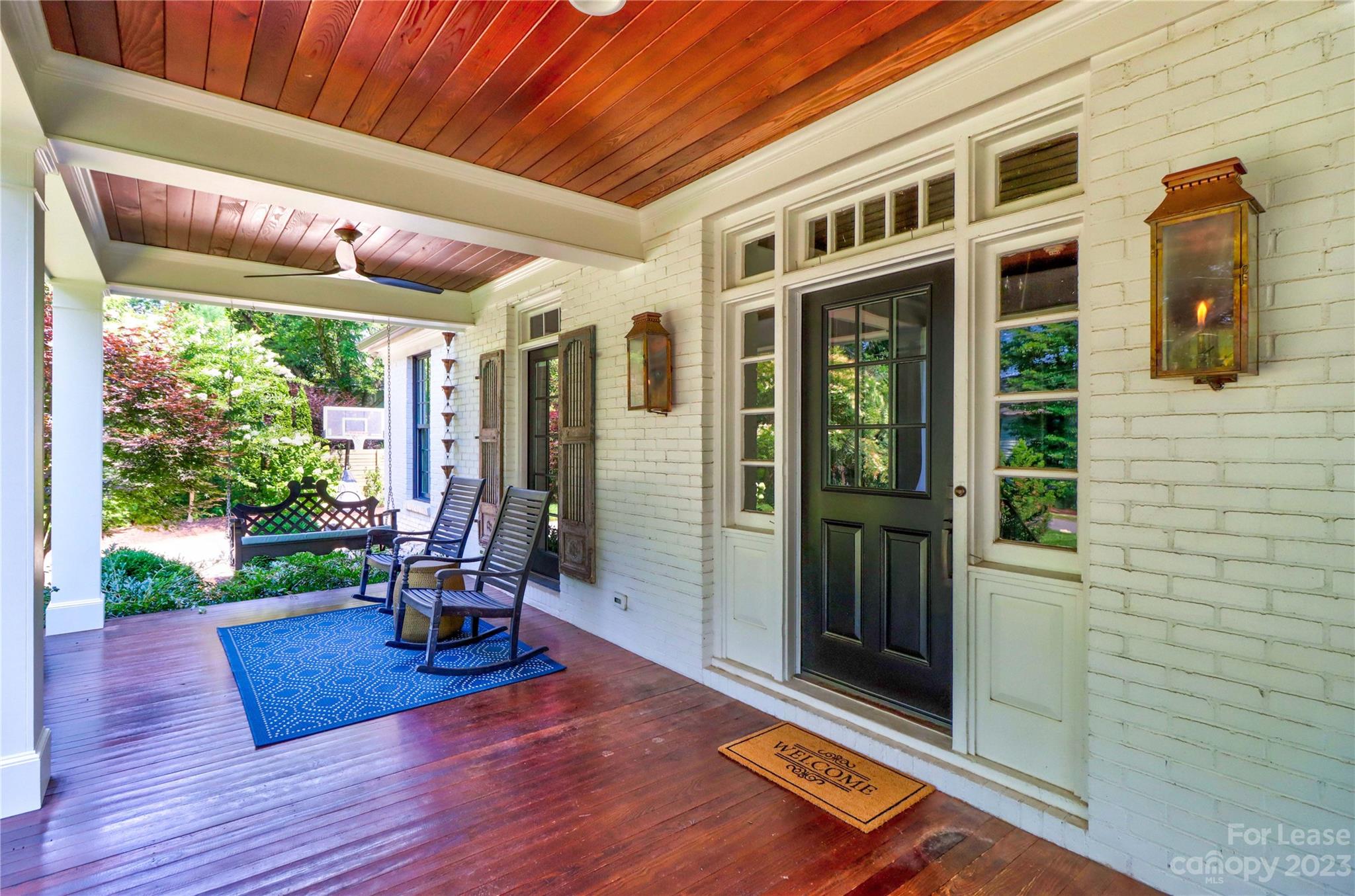 517 Lorimer Road Davidson, NC 28036 - Photo 7 of 48 a view of a porch with wooden floor