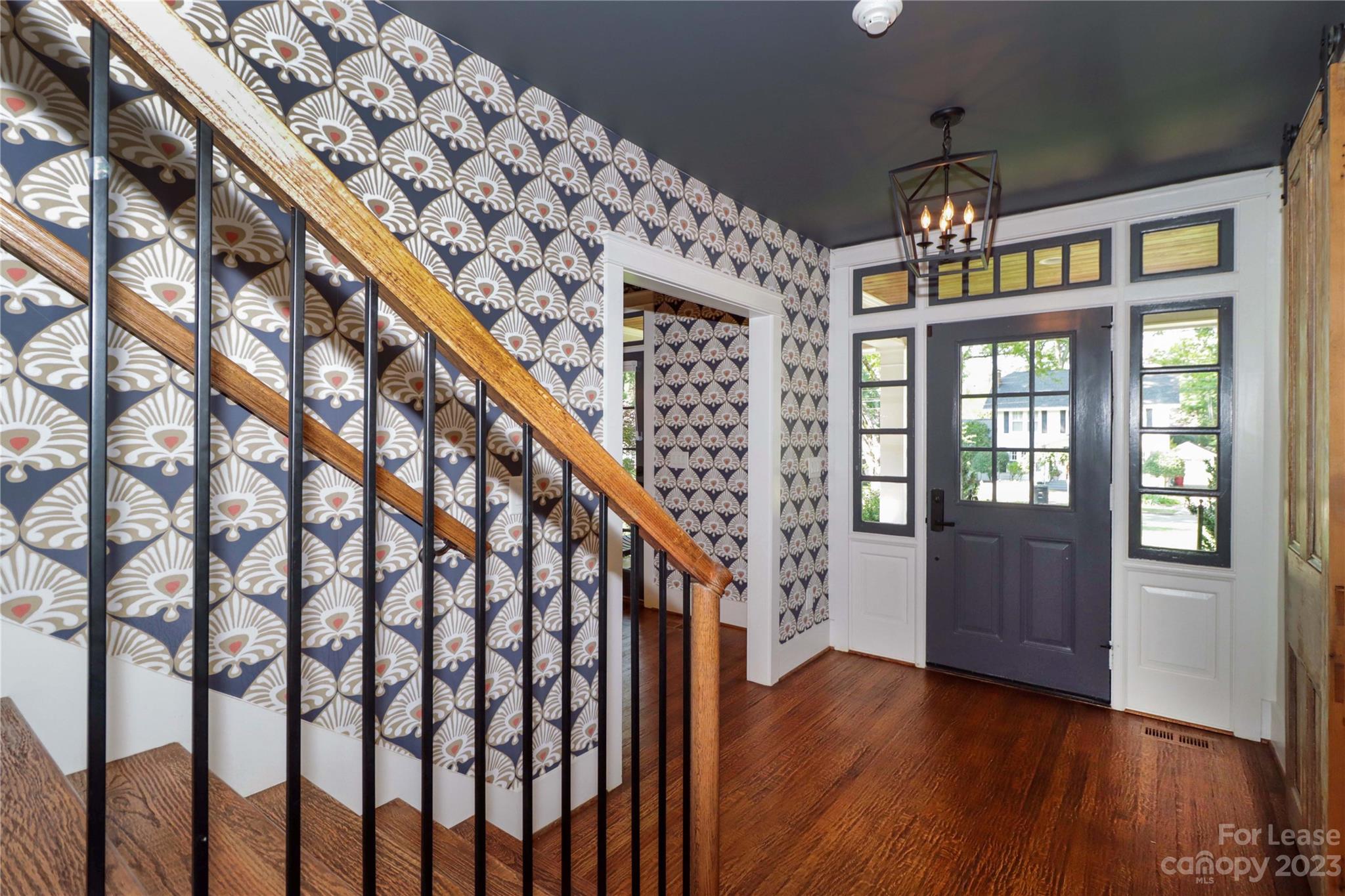 517 Lorimer Road Davidson, NC 28036 - Photo 8 of 48 a view of entryway with wooden floor and stairs