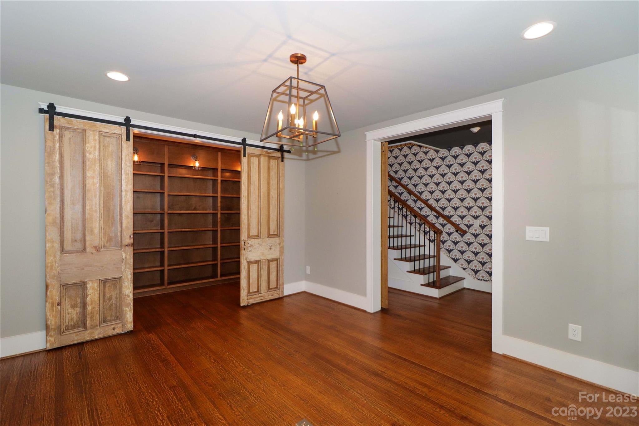517 Lorimer Road Davidson, NC 28036 - Photo 10 of 48 wooden floor in an empty room with a window
