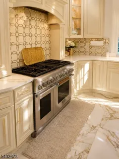 a stove top oven sitting inside of a kitchen