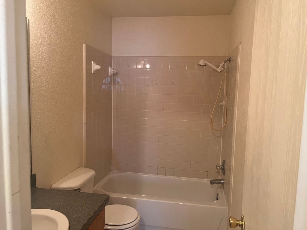 4404 Mattie Drive, Unit A Killeen, TX 76549 - Photo 8 of 8 a bathroom with a toilet and a shower