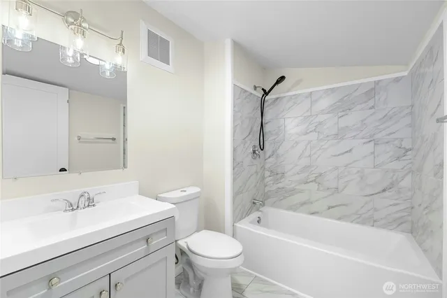 a bathroom with a sink a toilet and a bathtub