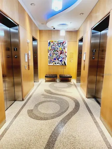 an outdoor sitting area with couch and chairs