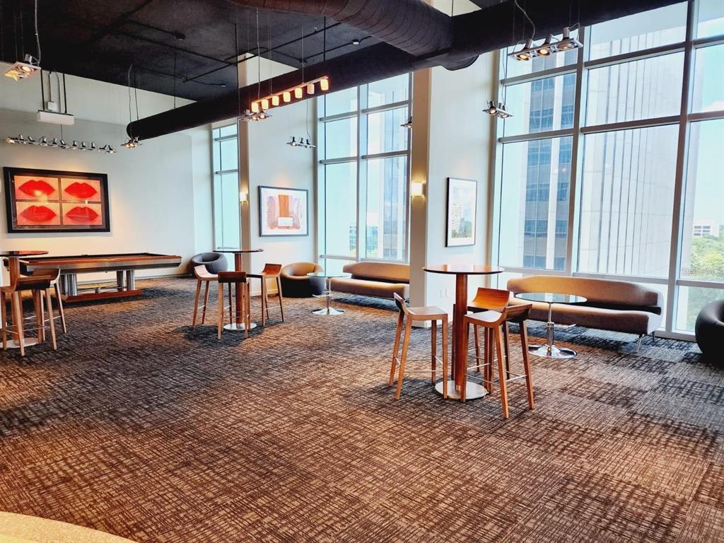 150 East Robinson Street, Unit 4A13 Orlando, FL 32801 - Photo 19 of 30 an outdoor sitting area with couch and chairs