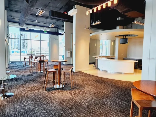 a view of a porch with chairs and backyard