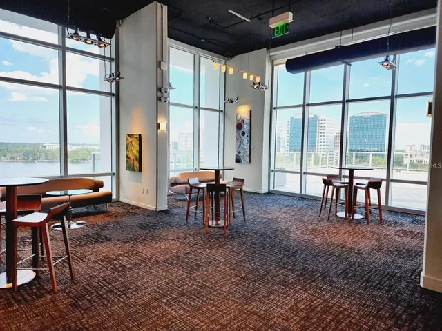 a living room with furniture and a rug