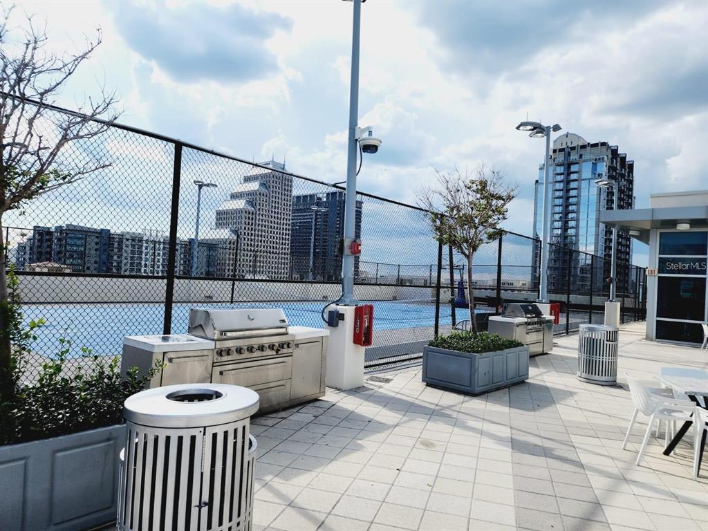 150 East Robinson Street, Unit 4A13 Orlando, FL 32801 - Photo 23 of 30 a view of a patio with couches and chairs